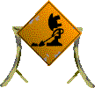 A yellow, diamond-shaped construction sign meant to indicate an area with construction work. Simple art of a Bionicle islander shovelling dirt is drawn on it.